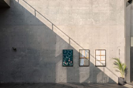 Morning light spills onto the cast finished concrete walls of the Atelier Deshaus designed Long Museum West Bund in Shanghai.