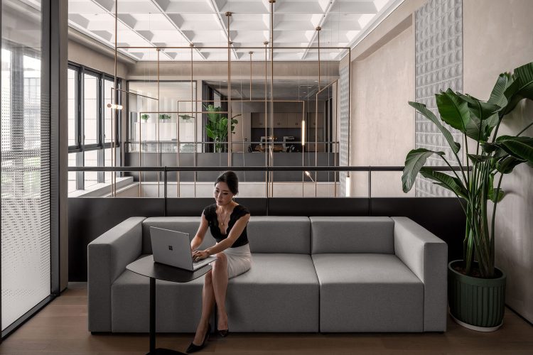 Collaborative work spaces inside Tengda's new workplace in Shanghai - interiors designed by Woods Bagot.